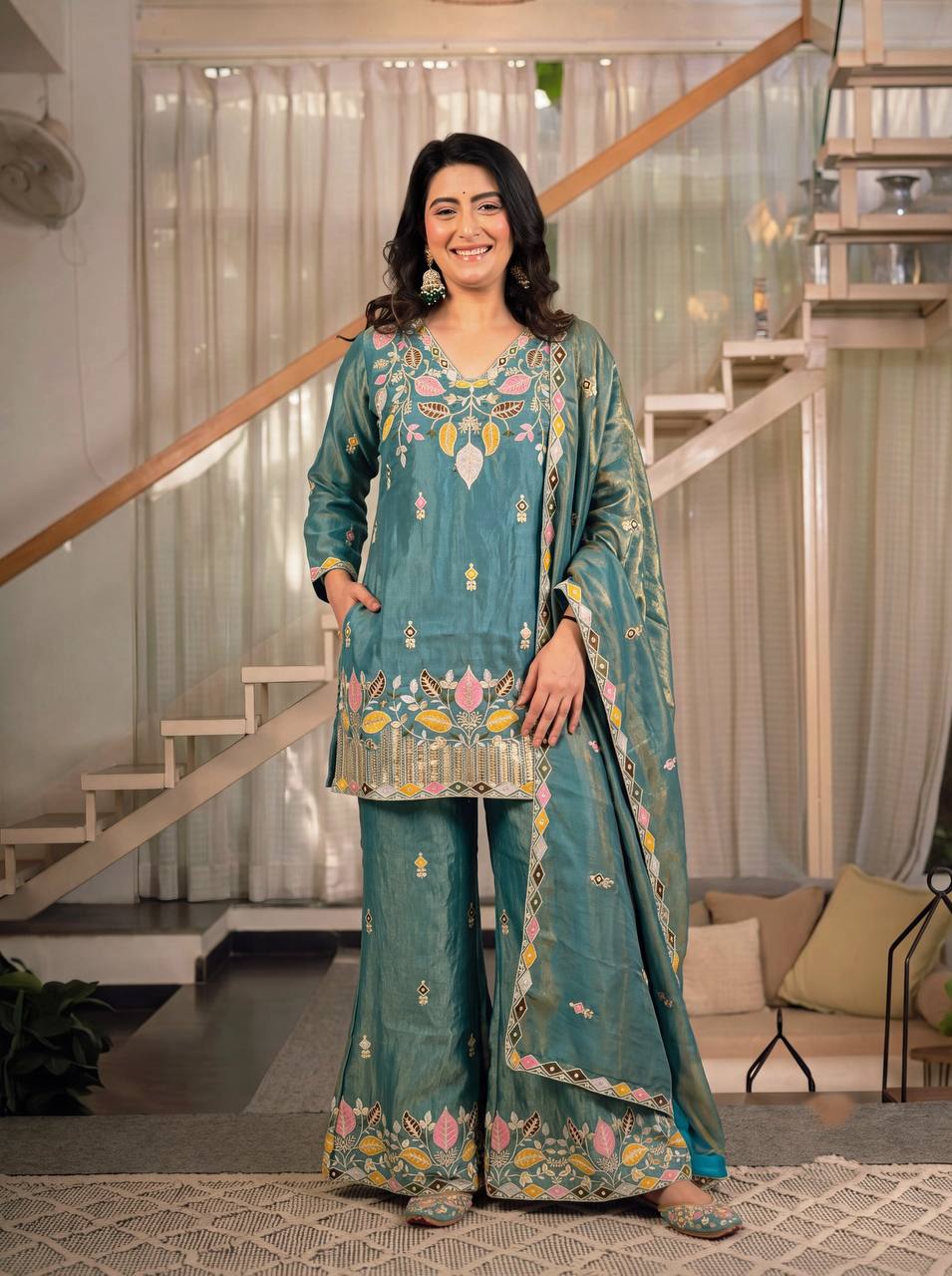 Elegant Rust Orange Silk Kurta and Flared Palazzo Set Adorned with Intricate Multicolored Botanical Embroidery and Mirror Work